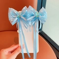 Pair of light blue butterfly hair clips with lace, sequin bear charms, and long tassels - Blue Streamer Clip Set