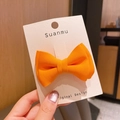 Handcrafted double-layered orange fabric bow hair clip on white presentation card - Orange