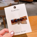 Fermaglio a fiocco in acetato tartarugato con strass colorati su scheda display - Papillon Blu Marrone