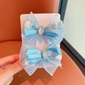 Pair of light blue mermaid bow hair clips with pearls and shell charms on display - 5-gemstone Sequin Bow