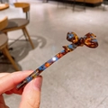 Eleganter Haarclip aus Acetat mit Schildpatt-Muster und stilvoller 3D-Schleife - Blau Braun