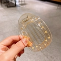 Pinza de pelo redonda plana de ámbar carey con un diseño ergonómico curvado - Champaña