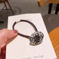 Elastic deep purple hair tie with leopard print resin buckle on display card - Sesame