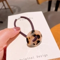 Deep purple elastic hair tie featuring a round tortoiseshell resin accent for ponytails - Light Tortoiseshell