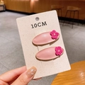 Pink PU leather oval hair clips with magenta crochet flowers in a two-piece set - Pink