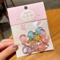 Set elastici per capelli bimbi con ciondoli glitterati a stella e cuore su carta - 12-Elastico Granchio