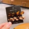 Set of two wavy acetate hair clips in tortoiseshell brown and cream with gold lettering - Tortoise