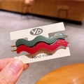 Matte wavy hair clips in dark green and deep red with gold lettering on display card - Red & Green