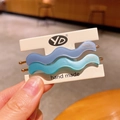 Blue wavy acetate hair clip set with golden accents on a handmade display card - Haze Blue and Sea Salt Blue