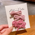 Four-piece set of pink plush velvet bow hair clips on a white display card - Red Series