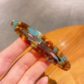 Barrette à cheveux ovale en acétate écaille de tortue ambre et bleu avec base en métal - Bleu Brun