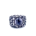 Detail of vintage dragon eye ring with blue stone and dragon scale textured steel band - Grey Eye