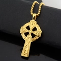 Macro shot of gold Celtic cross pendant with intricate knot patterns on black stand - Celtic Knot Cross (Gold Pendant Only)