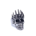 Macro view of vintage silver skull ring with a spiked crown and antique gothic texture - US 8 / Steel