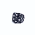 Detail view of vintage gothic floral relief patterns on an oxidized steel band ring - US 7 / Hexagram
