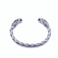 Detail of vintage silver wolf head terminals and twisted rope design on viking cuff bracelet - Steel