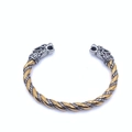 Detailed close-up of Viking wolf head bangle with silver and gold twisted metal texture - Two-tone (Gold & Silver)