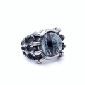 Detail of vintage punk dragon claw ring with blue demon eye stone and silver finish - Grey Eye