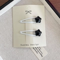 Pinza para el pelo con forma de estrella para niños en metal blanco con estrella negra - Clip Blanco Con Estrella Negra (5623032832814) / Blanco