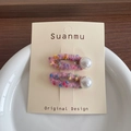 Pink handmade wool felt hair clips set with pearls on a stylish display card - Pink