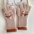 Beige children's knitted gloves with a brown smiley face pattern and ribbed cuffs - Khaki