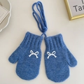 Blue knitted winter mittens for girls featuring a white bow and anti-loss neck string - Blue