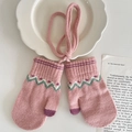 Pink knitted winter mittens for kids with green wave patterns and hanging neck cord - Pink
