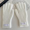 Winter white knitted gloves for kids with ribbed texture and minimalist fabric label detail - White