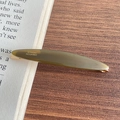 Olive green acetate hair clip with golden France Creation label on a vintage book - 5-Army Green