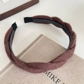 Deep brown knitted twist headband with plush texture and non-slip inner grip - Brown