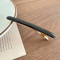 Minimalistische schwarze Acryl-Haarspange mit polierter goldener Metallbasis - Schwarz