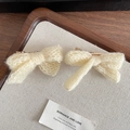 Pair of cream white knitted bow hair clips with soft textured yarn for winter - Off White