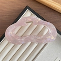 Translucent pale pink aurora hair claw clip with irregular hollow wave design for women - Pink