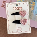 Set of two pink glitter heart hair clips with black velvet base on display card - Pink Heart Style