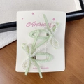 Green plaid bow hair clip set with white faux pearls on display card for girls - Green