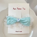 Sweet mint green lace bow hair clip with crystal heart detail on display card - Green Hair Clip