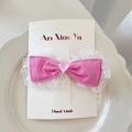 Sweet pink bow hair clip with white lace trim and heart charm on white ceramic plate - Pink Hair Clip
