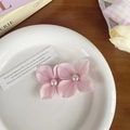 Pair of soft pink orchid hair clips with white pearls on a decorative white plate - Light Pink