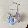 Élastique à cheveux étoile fleurie et bleue avec perle rose sur carte de support - Élastique Cheveux Étoile Bleue