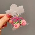 Close-up of pink peach charm elastic hair ties for girls in detailed packaging - Peach