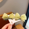 Detail of light green double-layer organza bow hair clips on display card - 1# Green