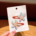 Glittering starfish hair clips for girls set of two pieces on a white display card - Orange Hair Clip