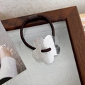 Deep brown elastic hair tie with a silver brushed metal flower charm minimalist style - Silver Flower