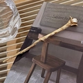 Spilla per capelli dorata vintage con fiore, perla e texture ramo su libro d'arte - Oro