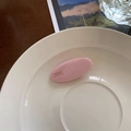 Pink oval minimalist resin hair clip featuring gold France Handmade logo lettering - Cream Pink