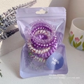 Spiralhaargummis Set in Lila Verlauf mit Blumenmustern im matten Geschenkbeutel - spiralförmige Haargummis / 6er Set / Lila