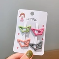Set of four matte butterfly hair clips in candy colors on a white display card - Butterfly Green