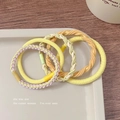 Set of 4 durable high-elasticity candy color hair ties in yellow and orange tones - Vitality Yellow Series