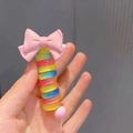 Candy colored spiral phone cord hair tie with a pink bow and rainbow resin rings - Pink Bow