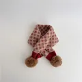 Detailed view of pink knitted scarf featuring argyle pattern and brown pom-pom accents - Pink Base Red (10#)